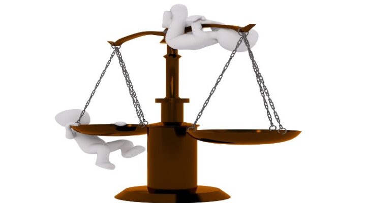 scale with 2 animated people hanging on it