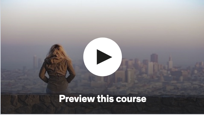 Course image, woman looking at busy city, with video link to preview