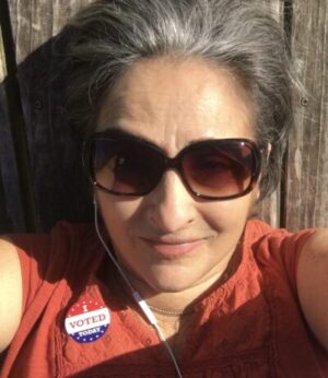 Terre in sun with I voted sticker on shirt