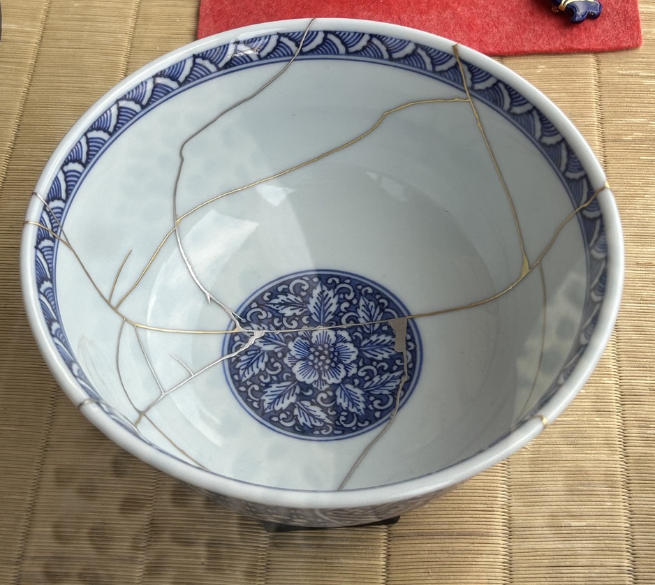 japanese bowl that's been repaired with gold - kinsugi in japanese